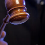 Judge. Male judge in a courtroom striking the gavel