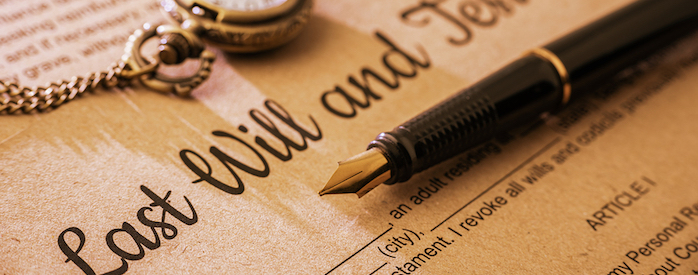 Vintage / retro style with a long shadow : Fountain pen a pocket watch on a last will and testament. A form is printed on a mulberry paper and waiting to be filled and signed by testator / testatrix.